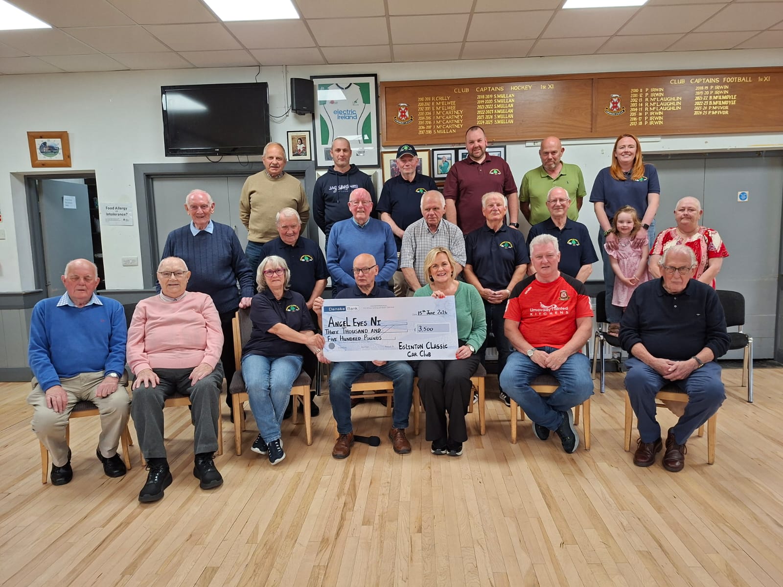 Presenting cheque to Angel E charityyes 